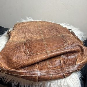 This is brown purse by Maxx New York